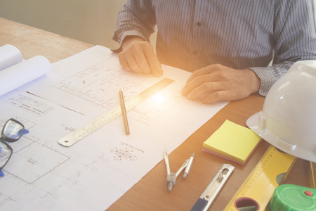 Architectural Office desk background construction project ideas concept, With drawing equipment with sunlight at morningの写真素材