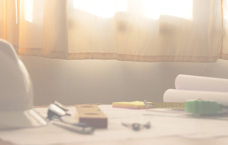 Desk of Architectural working project in construction siteの写真素材