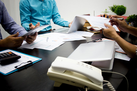 Businessman analysts make decisions about the US economy that affect future operations of the...