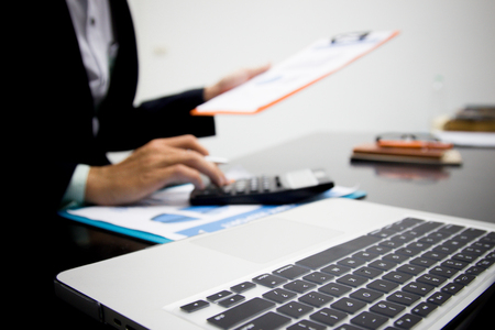 Business analysts make decisions about the US economy that affect future operations of the company.の写真素材