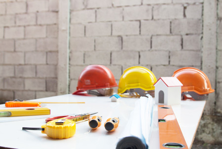 Desk of Architectural working project in construction site,With drawing equipment.Architectural...