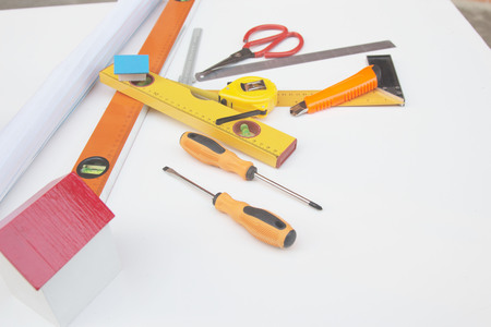 Desk of Architectural working project in construction site,With drawing equipment.Architectural...
