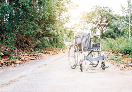 Disabled man is wheelchair at street.conceptの写真素材