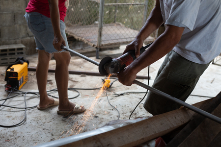 Men are welding iron to make a dog cage.close upの写真素材