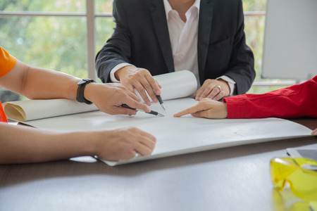 Team Engineermen and Architect discuss at Construction Site with blueprint.Architect work conceptの写真素材