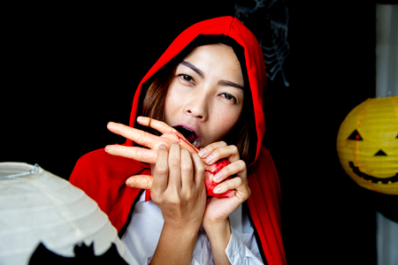 wizard women in red costume and hat for Halloween  backgroundの写真素材