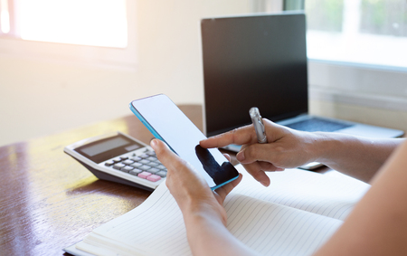 Business woman hand working with notepad on workplace in office, Search Engine Optimization, lifestyle woman and technology communicationの写真素材