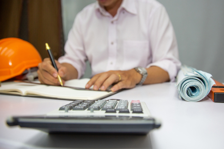 Engineering is calculating the structure of a residential building project at Construction.conceptの写真素材