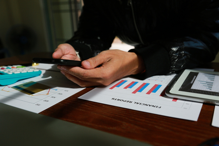 Businessme using searching for data Analyze competitors in office.investments conceptの写真素材