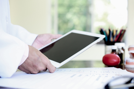 Looking for information about preparing for the treatment of patients with oral and dental problems.の写真素材