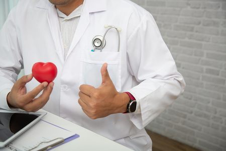 Doctors are encouraging patientson doctors table in hospital. to have the power to fight off illness.の写真素材