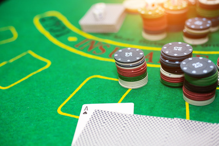 Casino equipment placed on the green floor for risky gambling for the people who want to get rich.
