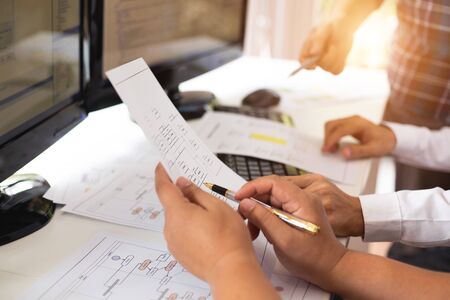 Hand team of programmers are discussing the use of online business investment management software in the future.business conceptの写真素材