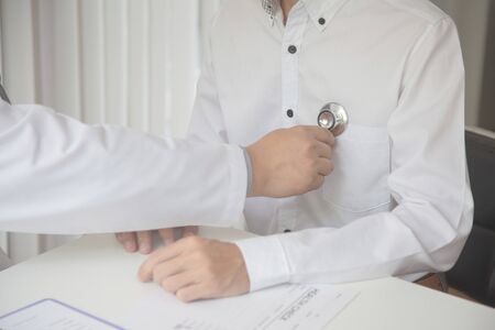 Doctors are encouraging patientson doctors table in hospital. to have the power to fight off...