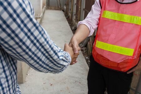 architect handshake Between manager to further invest in the future.の写真素材