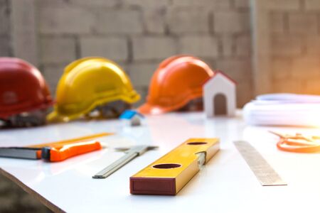 Desk of Architectural working project in construction site,With drawing equipment.Architectural...