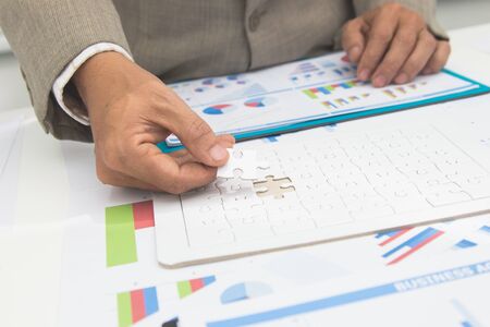 Businessmen hand are invstment project rsidence at work office.Concept Business.の写真素材