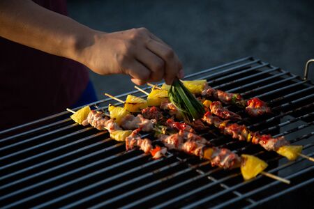 Barbeque Grill Street Food in thailand,Eat outdoors in a happy family. holiday celebration concept
