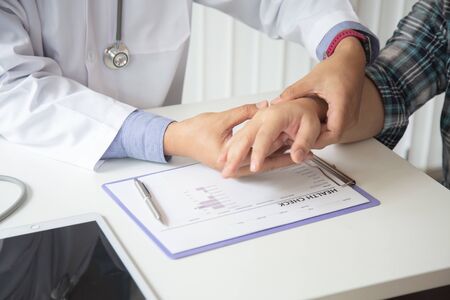 Doctors are encouraging patientson doctors table in hospital. to have the power to fight off illness.の写真素材