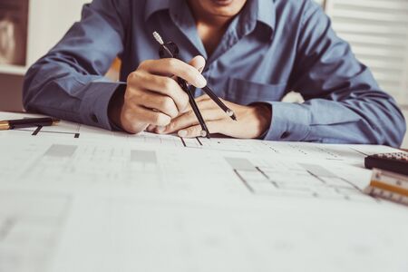 Architect drawings blueprint  at Construction Site