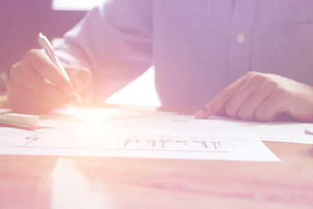 businessman working use laptop in office for discussing documents and ideas , with soft focus,...