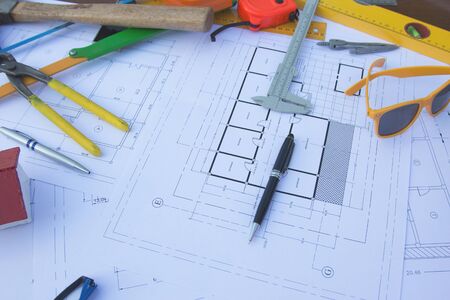 Architectural work site desk background construction project ideas concept, With drawing equipment
