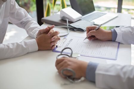 Doctors are encouraging patientson doctors table in hospital. to have the power to fight off...