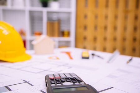 Architect desk tool working with blueprints in the office.Home Project to Offer Management.