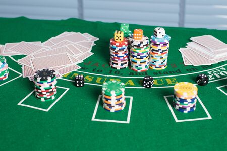Casino equipment placed on the green floor for risky gambling for the people who want to get rich.
