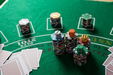 Casino equipment placed on the green floor for risky gambling for the people who want to get rich.の写真素材