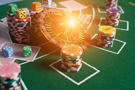 Casino equipment placed on the green floor for risky gambling for the people who want to get rich.の写真素材