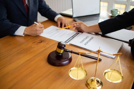 The lawyer is explaining the principles of law for people who come to listen to counseling to...
