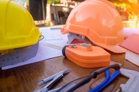 Architect desk engineering concept,construction site, soft focus, vintage tone, working with...