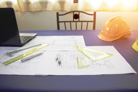 Architect desk ,Business,engineering concept,construction site, soft focus, vintage tone, working with blueprints in the officeの写真素材