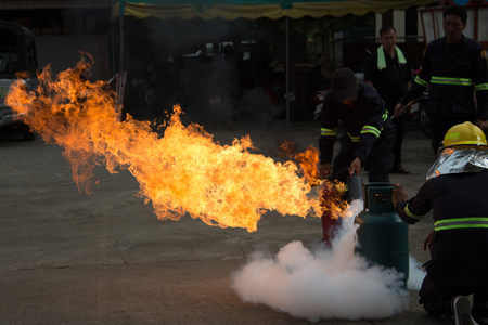Firefighters are rehearsing firefighting plans to prevent accidents in the office.のeditorial素材