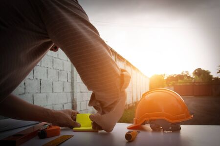 Engineer and Architect planing and discuss at Construction Site with blueprintの写真素材