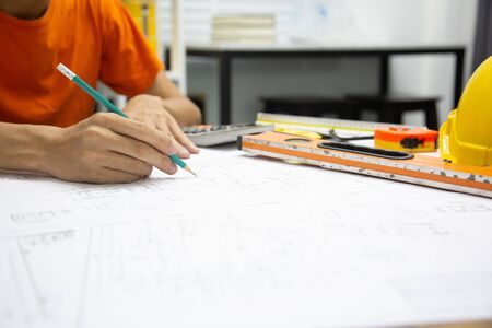 Architect Designing in blueprint at Construction Site With drawing equipment.conceptの写真素材