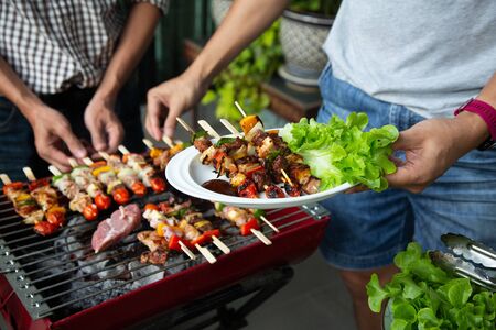 Barbeque Grill Street Food in thailand,Eat outdoors in a happy family.