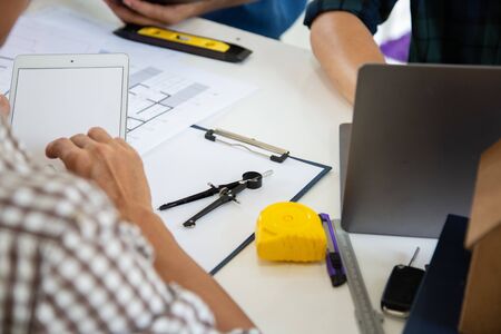 Team work Architectural work site desk background construction project ideas concept, With drawing...