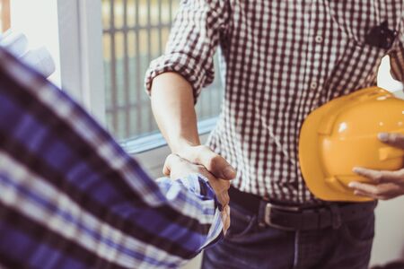 Engineering shaking  Hands Architectural with the agreement to agree on a residential construction project.conceptの写真素材