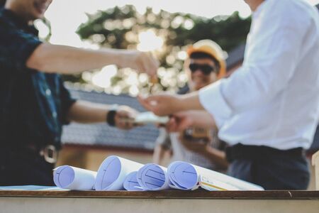 Team Engineers are writing solar panel for home construction designs to bring them to prospective customers.conceptの写真素材