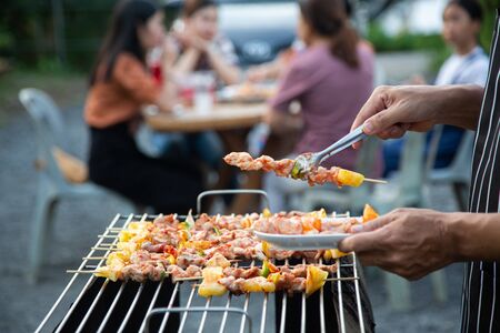 Barbeque Grill Street Food in thailand,Eat outdoors in a happy family. holiday celebration conceptの写真素材
