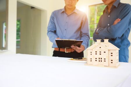 businessman team is analyzing the cost of housing projects to live with lifestyle.business concept, soft focus, vintage toneの写真素材