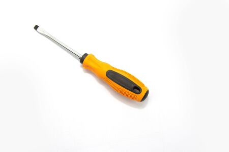 A yellow screwdriver placed on a white background for an electricianの写真素材