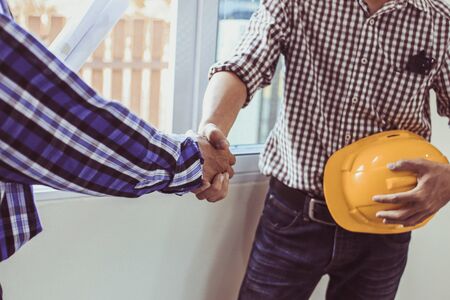 Engineering shaking  Hands Architectural with the agreement to agree on a residential construction project.conceptの写真素材