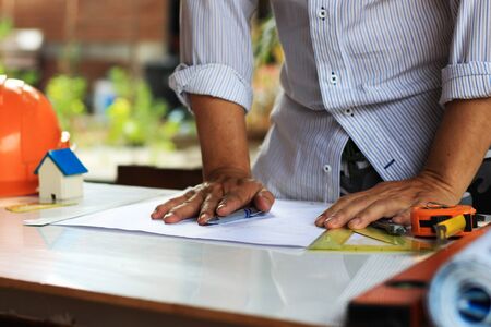Architectural work site desk background construction project ideas concept, With drawing equipment
