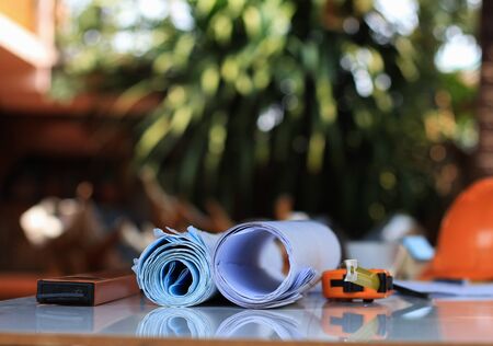 Desk of Architectural working project in construction site With drawing equipment concept.の写真素材