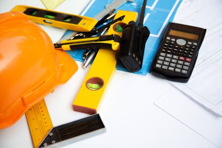 Architect desk concept,construction site working with blueprints in the office.Home Project to Offer...