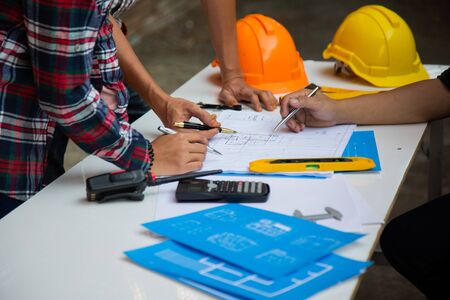 Engineers are meeting to discuss the design of a residential project.concept