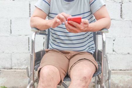 Disabled man is wheelchair at street.concept